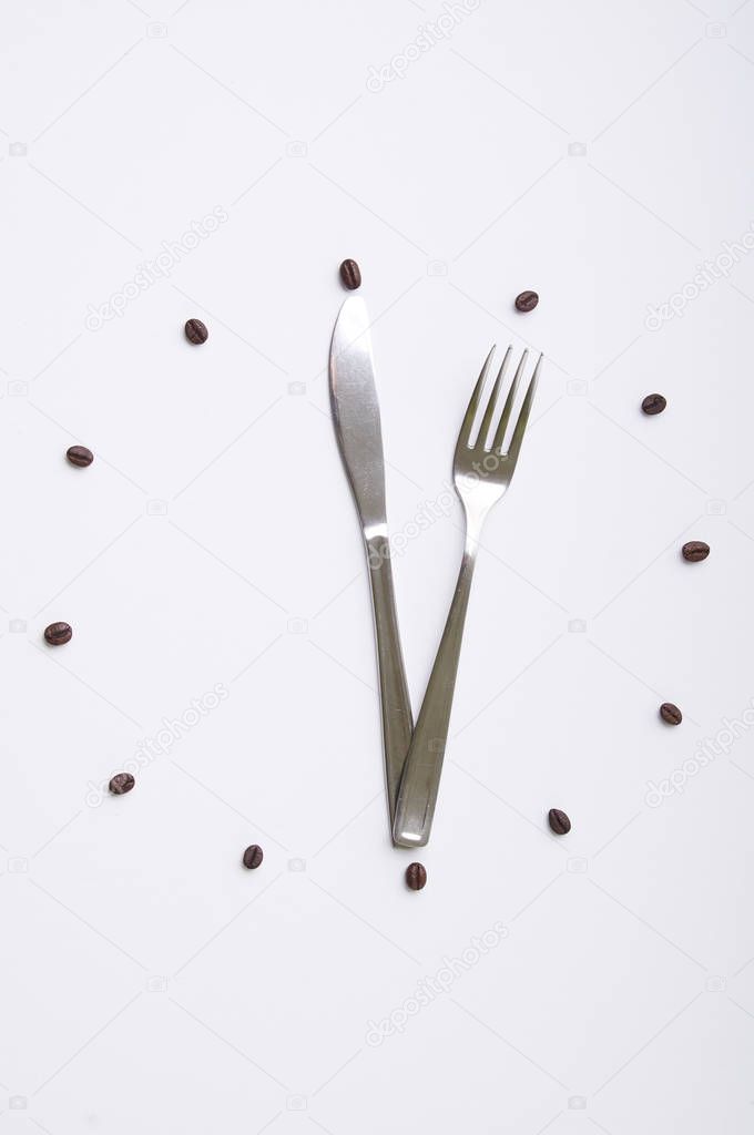 clock with fork and knife on white background