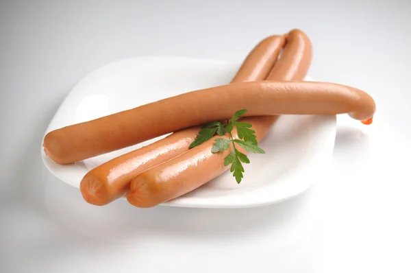 Sausages on a white background — Stock Photo, Image