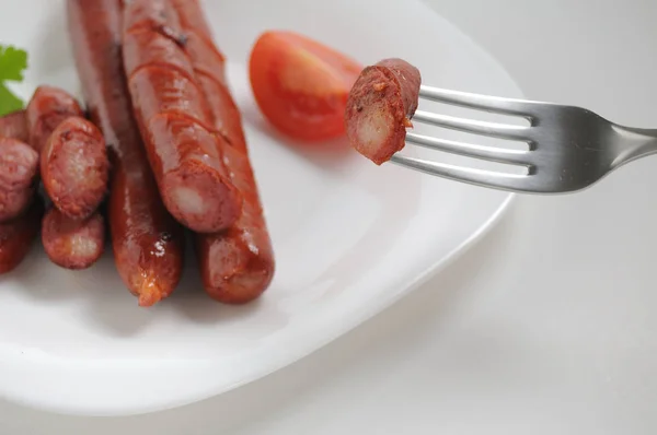 Sausages on a white background — Stock Photo, Image