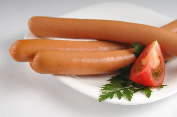 Sausages on a white background — Stock Photo, Image