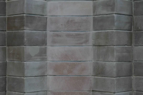 Un mur de grandes briques grises — Photo