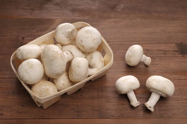 Mushrooms on a wooden table — Stock Photo, Image