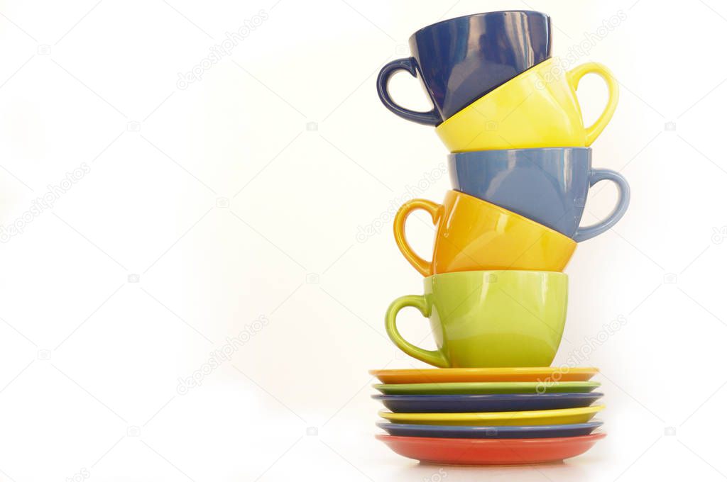 colored cups and plates