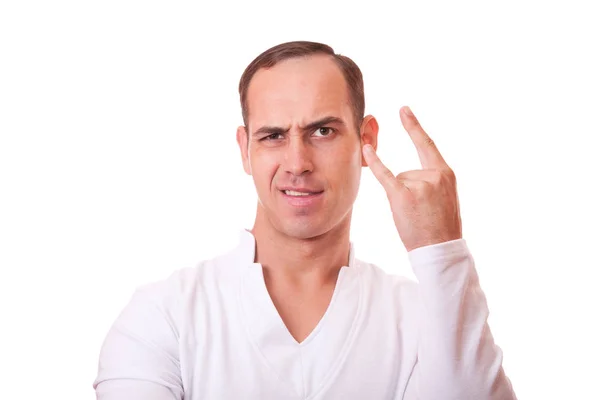 Portrait of a young man in white background showing a sign of ro — Stock Photo, Image