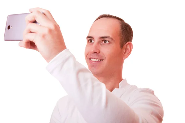Portrait of a young man making a selfie for mobile phone white b — Stock Photo, Image
