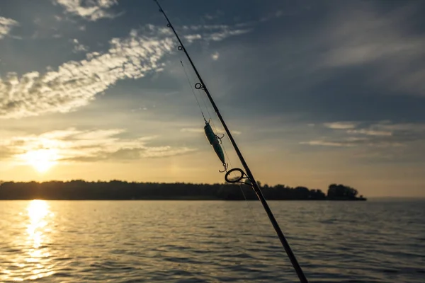 Fishing wobbler hooked on a spinning — Stock Photo, Image