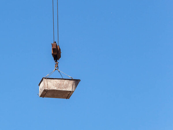 Hook block with a bucket