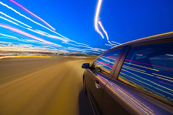 View from Side of Car moving in a night city