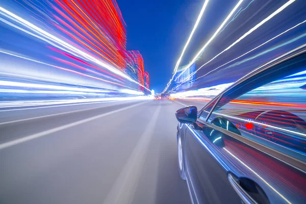 View from Side of Car moving in a night city