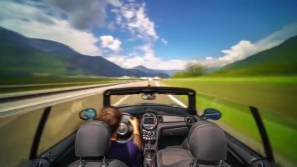 Man in a cabrio car driving in Italian mountains — Stock Video