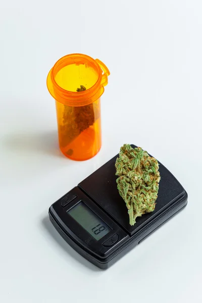 Marijuana Cannabis Bud Weighed On Digital Electronic Scale. Sele