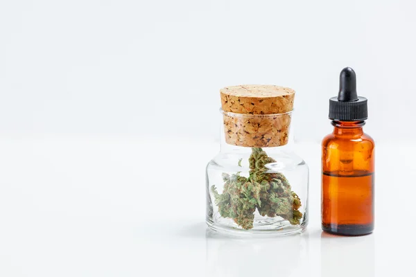 Medical Marijuana In Glass Jar Cannabis Oil Extract In Bottle Is — Stock Photo, Image