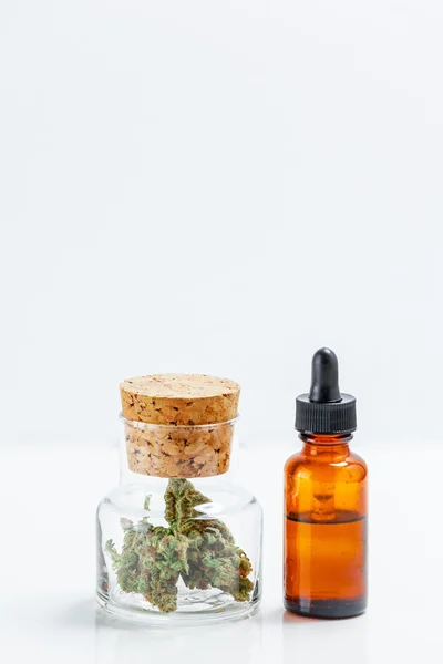 Medical Marijuana In Glass Jar Cannabis Oil Extract In Bottle Is — Stock Photo, Image