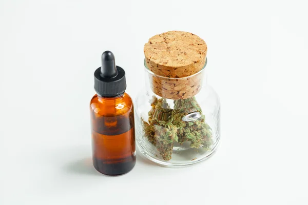 Medical Marijuana In Glass Jar Cannabis Oil Extract In Bottle Is — Stock Photo, Image