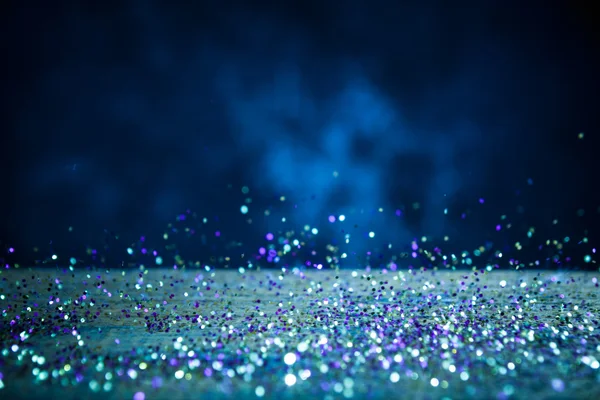 Sarı ve mor parlak ışıklar arka plan. Vintage ışıltı Bokeh