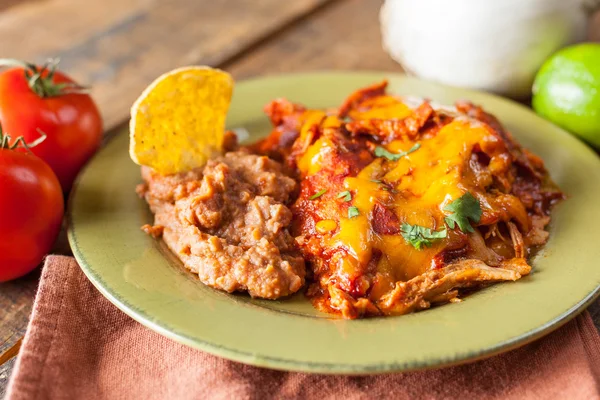 Chicken Enchilada Mexican Food Casserole Served On Rustic Green Plate — Stock Photo, Image