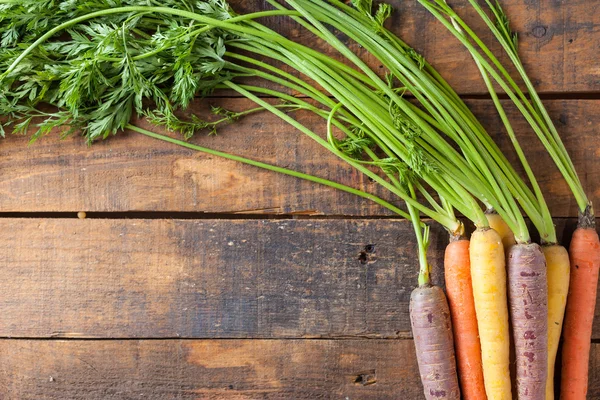 Organic Raw Carrots On Vintage Rustic Wood Texture Table Background — Stok Foto