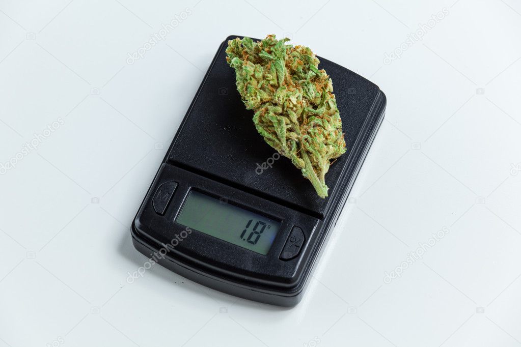 Marijuana Cannabis Bud Weighed On Digital Electronic Scale. Sele Stock  Photo by ©TPOphoto 125364272