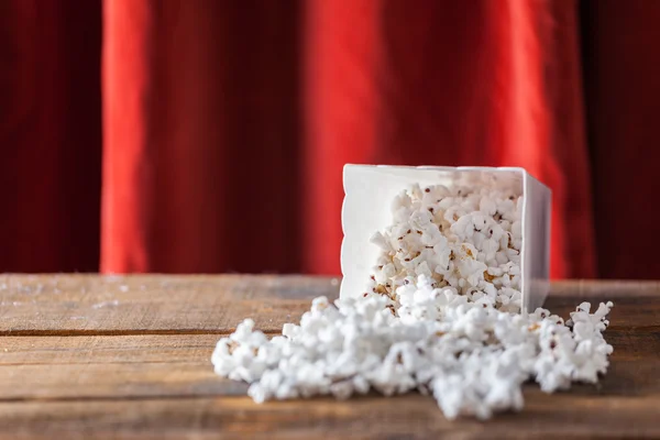 Popcorn In Classic Cinema Serving Box On Wood Background