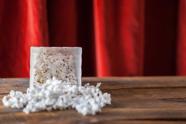 Popcorn In Classic Cinema Serving Box On Wood Background