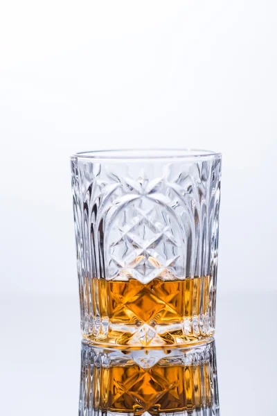 Whiskey on the rocks on glass table — Stock Photo, Image