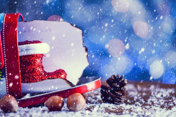 Snow Falling On Christmas Letter In Mailbox Decorated With Santa. Vintage Filter Applied.