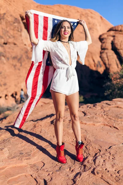 Beautiful Young American Girl Model Wearing White In Red Rocky Desert
