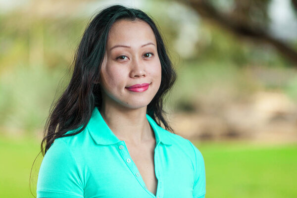 Pretty Asian Young Woman Grinning In Close Up Portrait