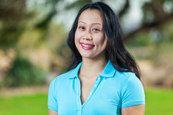 Asian Young Woman Portrait Smiling Wearing Blue Polo Shirt