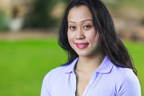 Pretty Asian Young Natural Woman Smiling In Close Up Portrait