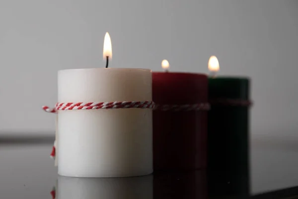 Pillar Candles In Dark Room Abstract Christmas Background.