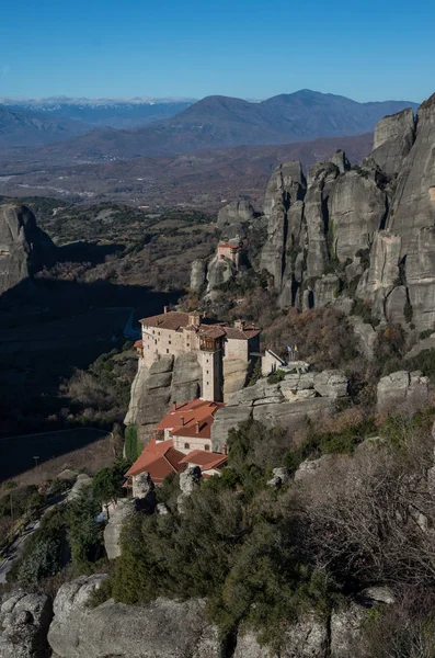 The Monastery of Rousanou or St. Barbara Monastery and the Monastery of St. Nicholas at Meteora. Meteora is one of the largest built complexes of Eastern Orthodox monasteries in Greece.