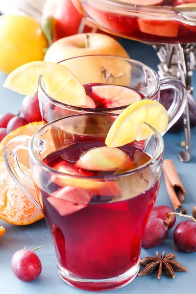 Glass jars with mulled wine. Hot wine for winter. Mulled wine, punch, grog. Hot fruit tea. Spices, fruit