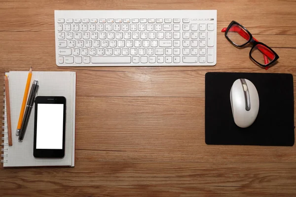 White keyboard with mouse and glasses.