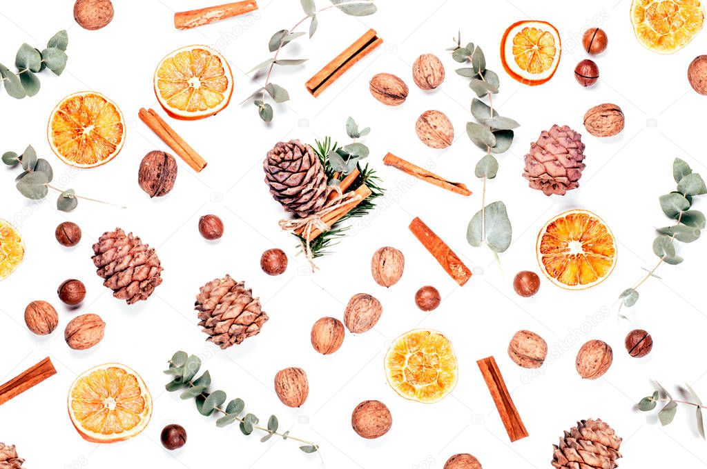 Christmas background with nuts, orange, cinnamon