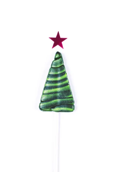 Kerstboom met rode ster vormige lolly — Stockfoto