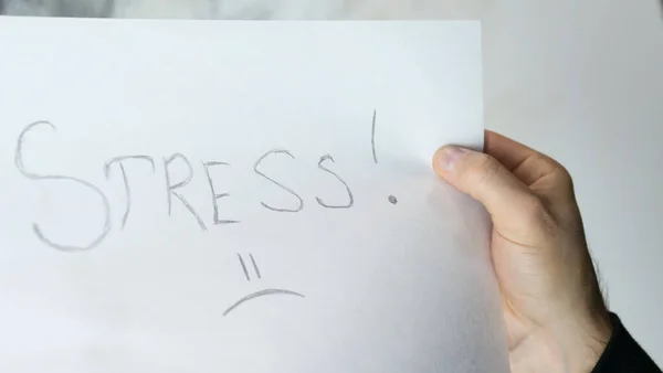 ストレスという言葉は白い紙に書かれています — ストック写真