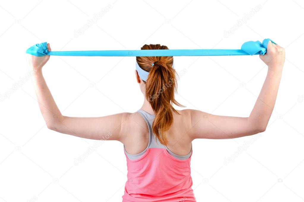 Fit young woman doing workout with physio latex tape, view from the back.  isolated on a white background