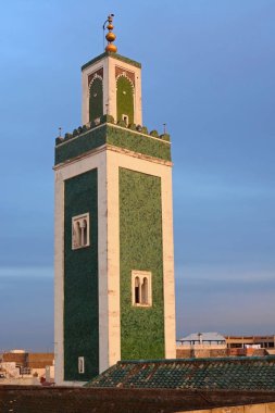 minaret of the Grande Mosque seen from the roof of Bou Inania Madrasa, Meknes, Morocco clipart