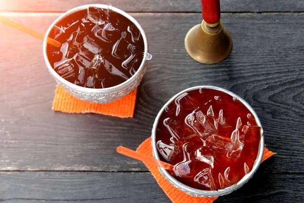 Black or red Thai ice tea drink in the silver bowl . — Stock Photo, Image