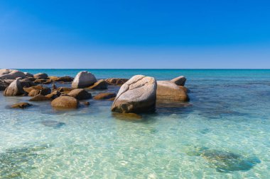 Lanscape view of white stones in blue sea.