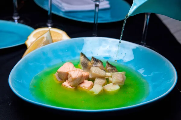 Fish fitness spring soup in a restaurant feeding from chef