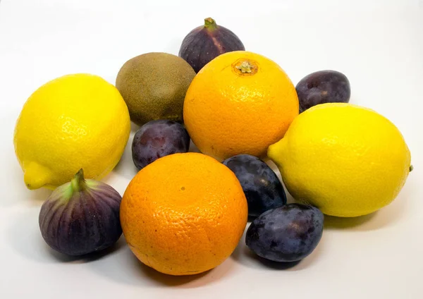 Close up of colorful fruits. Different fruits on the white background.
