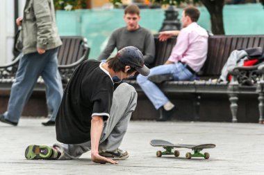 2011.05.21, Moscow, Russia. A student skateboarding at the square bihand the Bolshoy theatre.