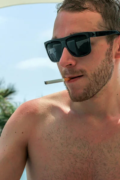 Young Guy Wet Hair Black Glasses Smiking Cigarette Beach — Stock Photo, Image