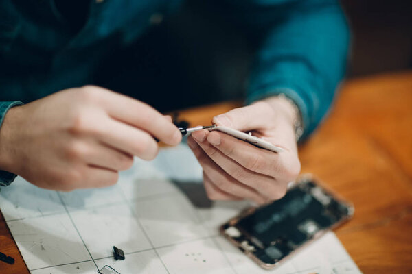 Repair mobile phone,close up