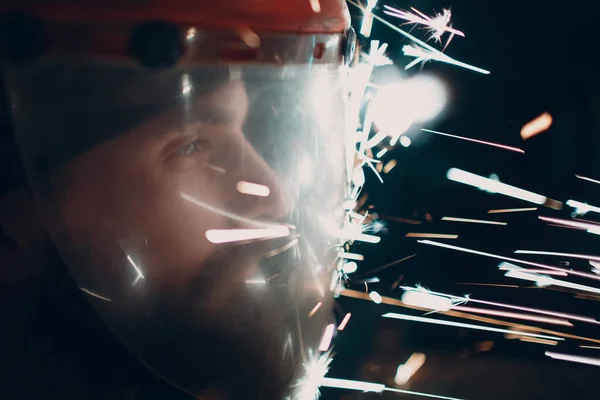 Adult Bearded Man Transparent Protective Mask Flying Metal Particles Sparks — Stock Photo, Image