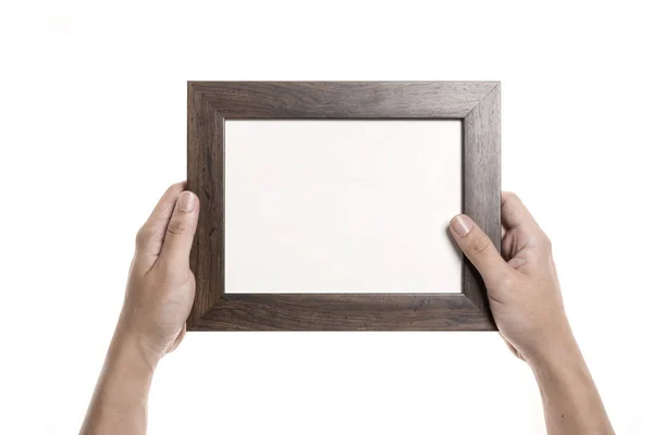 Sostener con la mano un marco de fotos vacío — Foto de Stock