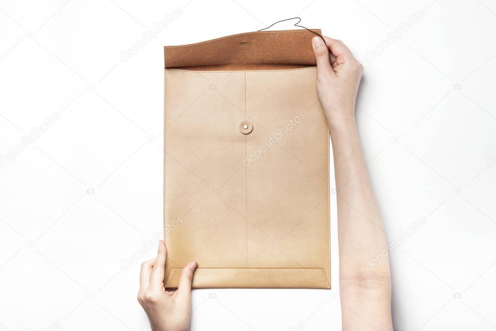 A brown leather envelope