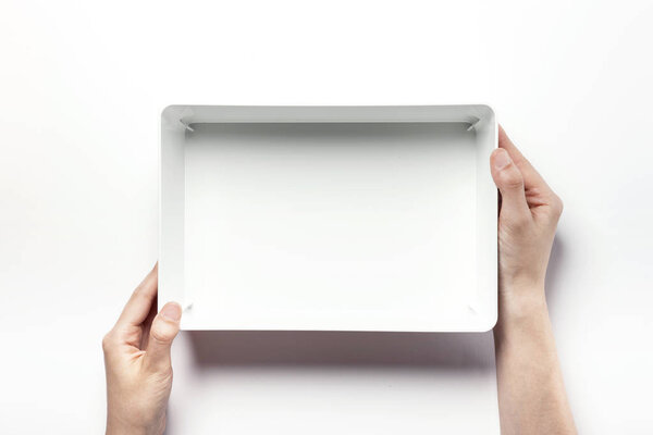 holding a white box